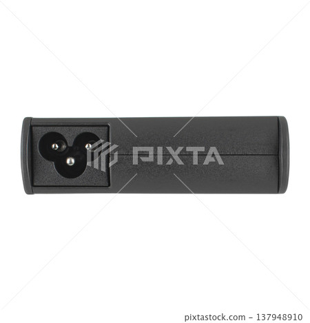 laptop power adapter, with a three-pin socket, on a white background 137948910