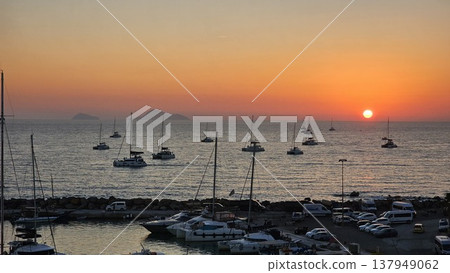 view of a marina filled with boats at sunset view of a marina filled with boats at sunset 137949062
