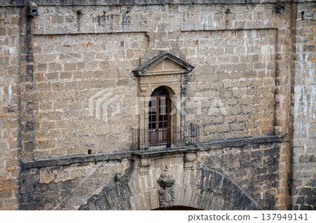 Walking along ancient streets enjoying historic architecture and charming atmosphere in Ronda, Spain. Walking along ancient streets enjoying historic architecture and charming atmosphere in Ronda, Spain. 137949141