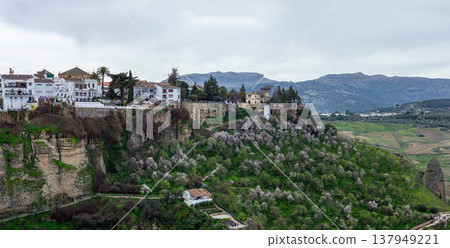 Panoramic view of surrounding landscapes and mountains from scenic elevated viewpoint in Ronda, Spain. 137949221