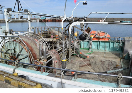 Fishing boat anchored at the fishing port Fishing boat anchored at the fishing port 137949281