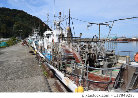 Fishing boat anchored at the fishing port Fishing boat anchored at the fishing port 137949283
