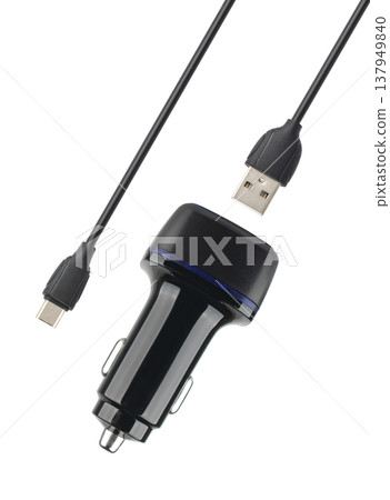 power adapter for the phone from the cigarette lighter, on a white background power adapter for the phone from the cigarette lighter, on a white background 137949840