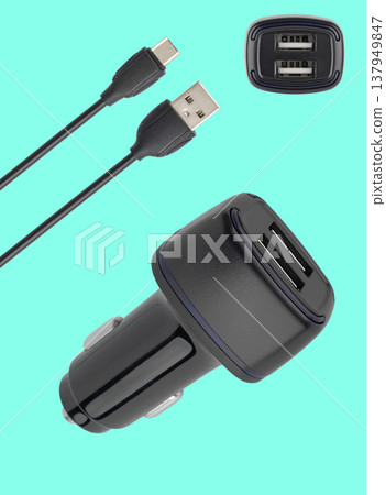 power adapter for the phone from the cigarette lighter, on a blue background power adapter for the phone from the cigarette lighter, on a blue background 137949847
