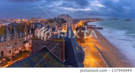 Evening beachfront cityscape and illuminated coast in Saint Malo Brittany France Evening beachfront cityscape and illuminated coast in Saint Malo Brittany France 137949944