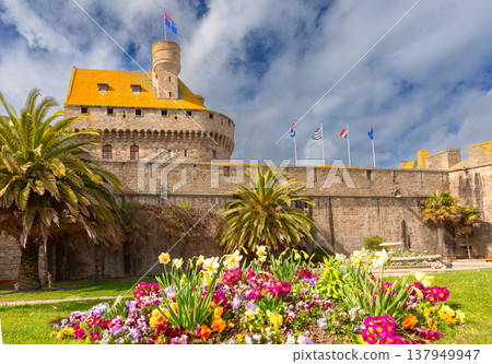 Stone fortress tower with flags in Saint Malo Brittany France Stone fortress tower with flags in Saint Malo Brittany France 137949947