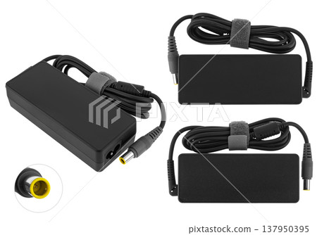 power adapter for a laptop, a spare part for a computer, on a white background power adapter for a laptop, a spare part for a computer, on a white background 137950395