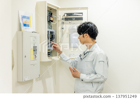 Man inspecting breaker Man inspecting breaker 137951249