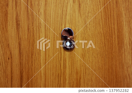 Close up view of door peephole Close up view of door peephole 137952282