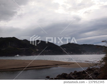 A sandy beach in the morning after the rain. A sandy beach in the morning after the rain. 137952345