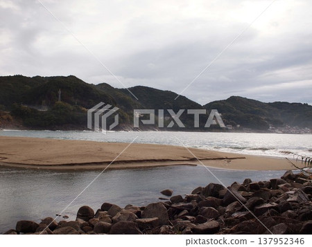 A sandy beach in the morning after the rain. 137952346