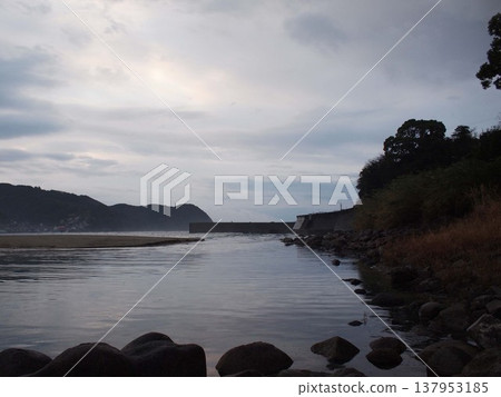 A sandy beach in the morning after the rain. 137953185