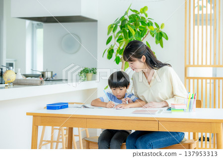 Children studying in the living room 137953313