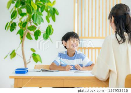 Children studying in the living room 137953316