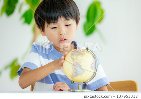 Children playing with a globe Children playing with a globe 137953318