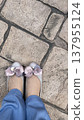 A woman's feet wearing sandals 137955124