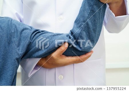 Physical therapy, Asian therapist doctor treat perform pain therapy in hospital. Physical therapy, Asian therapist doctor treat perform pain therapy in hospital. 137955224
