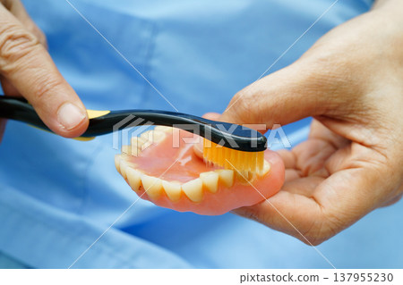 Clean teeth denture with toothbrush for chew food. 137955230