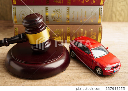 Bangkok, Thailand March 15, 2023 Car accident lawsuit and insurance, Judge hammer with car model. Bangkok, Thailand March 15, 2023 Car accident lawsuit and insurance, Judge hammer with car model. 137955255
