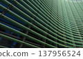 Reflections and geometric patterns on the glass facade (abstract urban background material) - an abstract capture of the exterior of glass architecture. 137956524