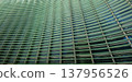 Reflections and geometric patterns on the glass facade (abstract urban background material) - an abstract capture of the exterior of glass architecture. 137956526