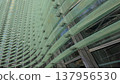 Reflections and geometric patterns on the glass facade (abstract urban background material) - an abstract capture of the exterior of glass architecture. 137956530