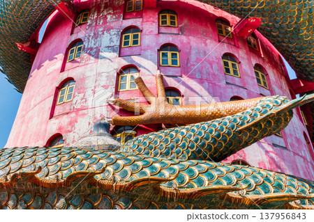 Giant Dragon Coiled Around Pink Tower, Wat Sam Phran or Dragon temple Nakhon Pathom, Thailand Giant Dragon Coiled Around Pink Tower, Wat Sam Phran or Dragon temple Nakhon Pathom, Thailand 137956843
