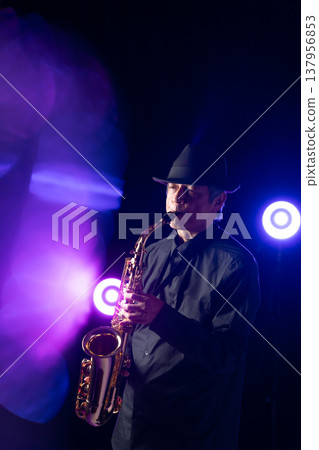 Man playing the saxophone live 137956853
