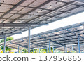 Aerial view of solar panels installed as shade canopy over parking lot with parked cars to generate electricity, photovoltaic technology. 137956865