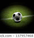 Soccer ball placed exactly on the white line on green grass soccer field, close-up view. 137957468