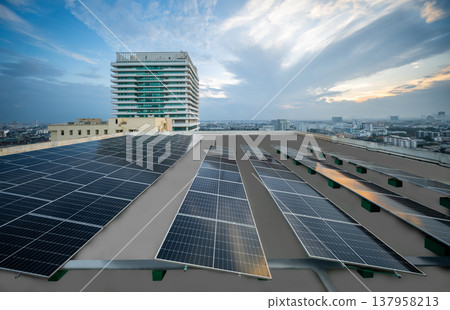 Solar Panel Photovoltaic installation on a Roof of factory, sunny blue sky background, alternative electricity source - Sustainable Resources Concept. 137958213