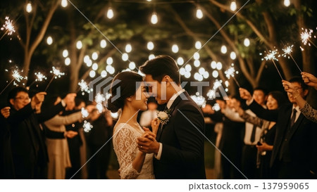 Wedding - Asian Couple Dancing Together During Sparkler Send Off at Romantic Outdoor Night Reception 137959065