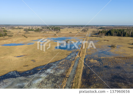 Flooded fields and channel in rural michalowo landscape 137960656