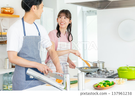 Young couple, kitchen, cooking Young couple, kitchen, cooking 137961238