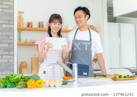 Young couple, kitchen, cooking 137961241