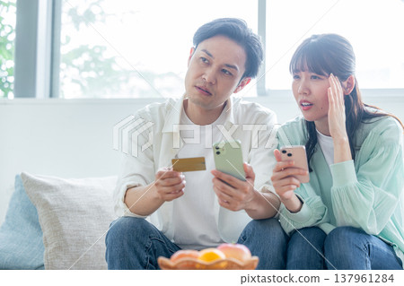 A couple struggling with payments A couple struggling with payments 137961284