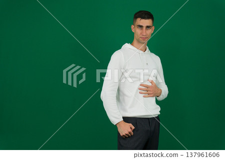 emotions of a handsome man guy on a green background chromakey close-up dark hair young man emotions of a handsome man guy on a green background chromakey close-up dark hair young man 137961606