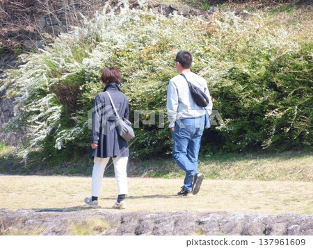 A couple taking a walk A couple taking a walk 137961609