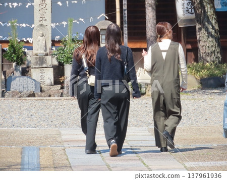 Women visiting at the shrine Women visiting at the shrine 137961936