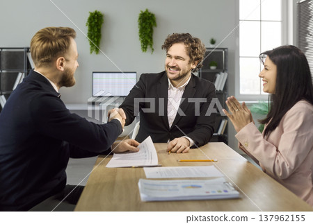 Successful job interview handshake with recruiter and candidate in modern office 137962155