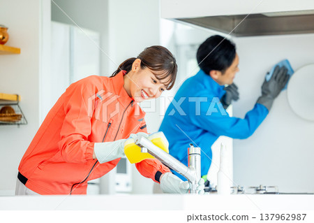 Male and female housekeepers Male and female housekeepers 137962987