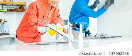 Male and female housekeepers Male and female housekeepers 137962988