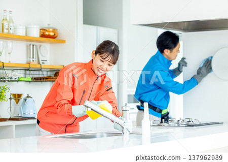 Male and female housekeepers Male and female housekeepers 137962989