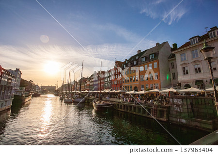 Nyhavn, a famous landmark in Copenhagen, the capital of Denmark, at sunset. 137963404