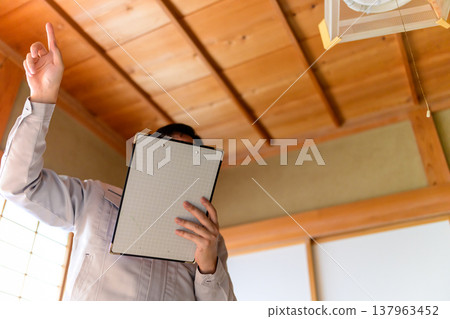 Workers conducting interior inspections Workers conducting interior inspections 137963452