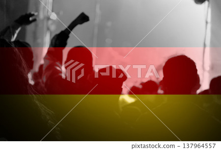 Anti-war protest in Germany concept. Blurred silhouettes of people at a demonstration with the German flag colors overlay. Social movement, activism, and political rally in Europe Anti-war protest in Germany concept. Blurred silhouettes of people at a demonstration with the German flag colors overlay. Social movement, activism, and political rally in Europe 137964557