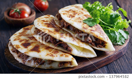 Authentic Mexican Beef Quesadillas or Tacos de Guisado: Golden Fried Tortillas Filled with Shredded Meat and Melted Cheese, Garnished with Fresh Cilantro on a Rustic Wooden Board 137964582