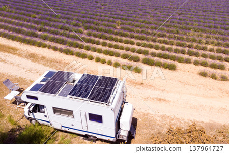 Caravan with solar panels on roof camping at lavender field Caravan with solar panels on roof camping at lavender field 137964727