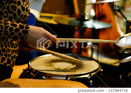 Musician drummer playing the drums. Musician drummer playing the drums. 137964738