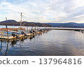 Evening view of the lake and moored fishing boats 137964816